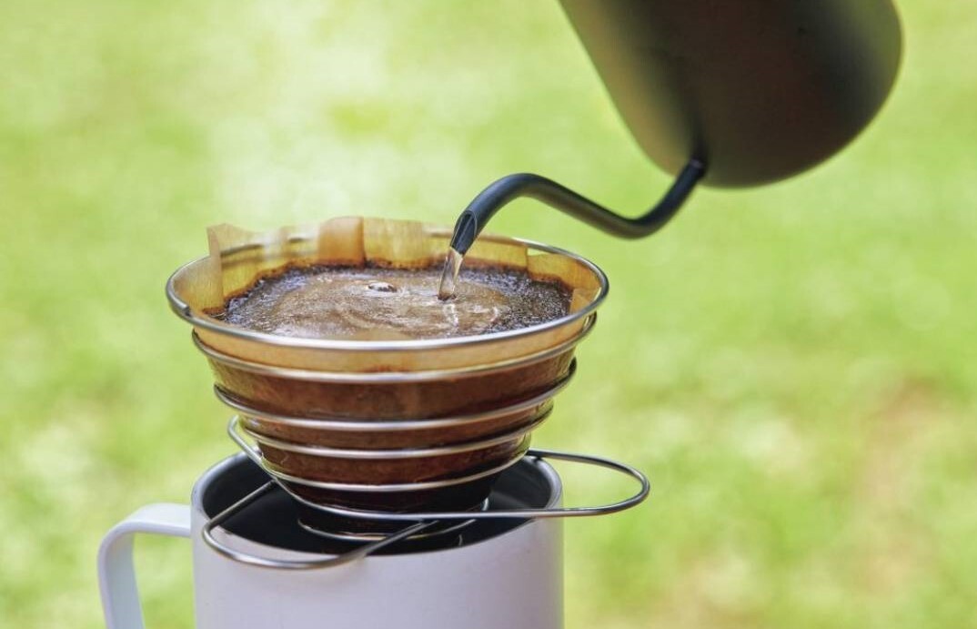 Drip coffee by the campfire under the stars
